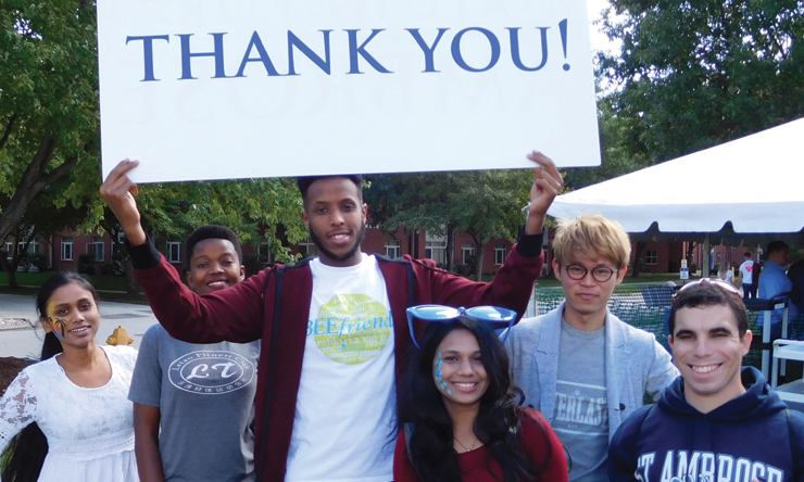students holding thank you sign